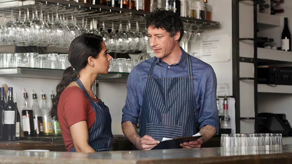 hospitality workers at the bar