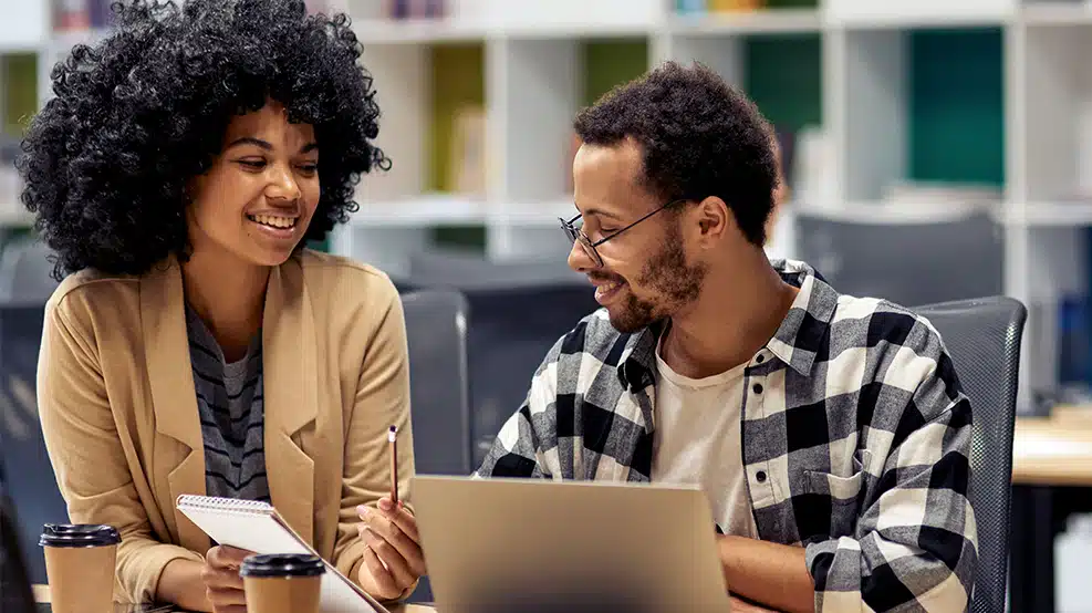 two people talking in an office